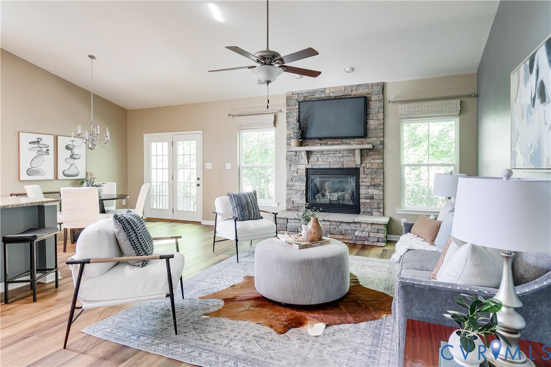 7538 South Franklins Way Quinton, VA 23141 - Photo 14 of 48 a living room with furniture a fireplace and a flat screen tv