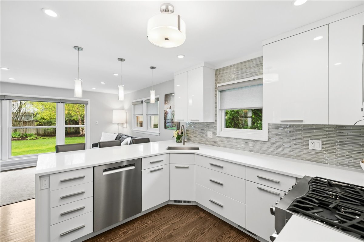 912 Hunter Road Wilmette, IL 60091 - Photo 15 of 38 a kitchen with a sink window and cabinets