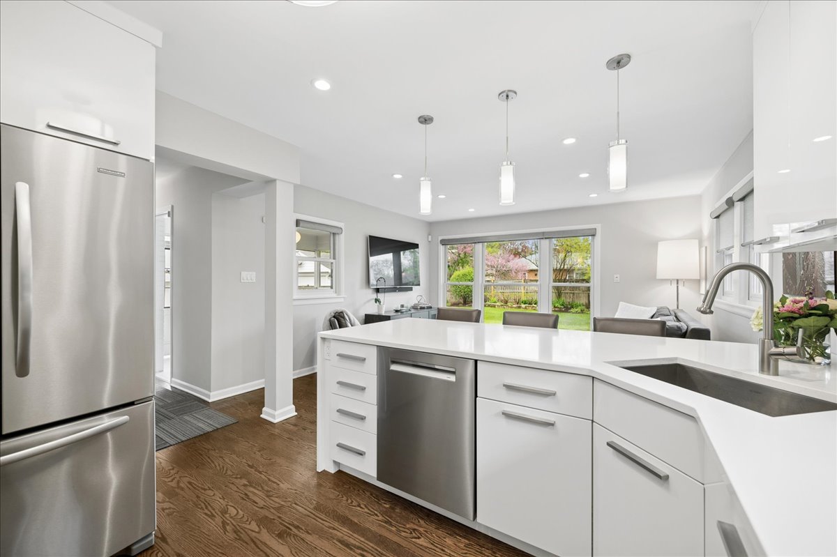 912 Hunter Road Wilmette, IL 60091 - Photo 16 of 38 a kitchen with white cabinets and white appliances