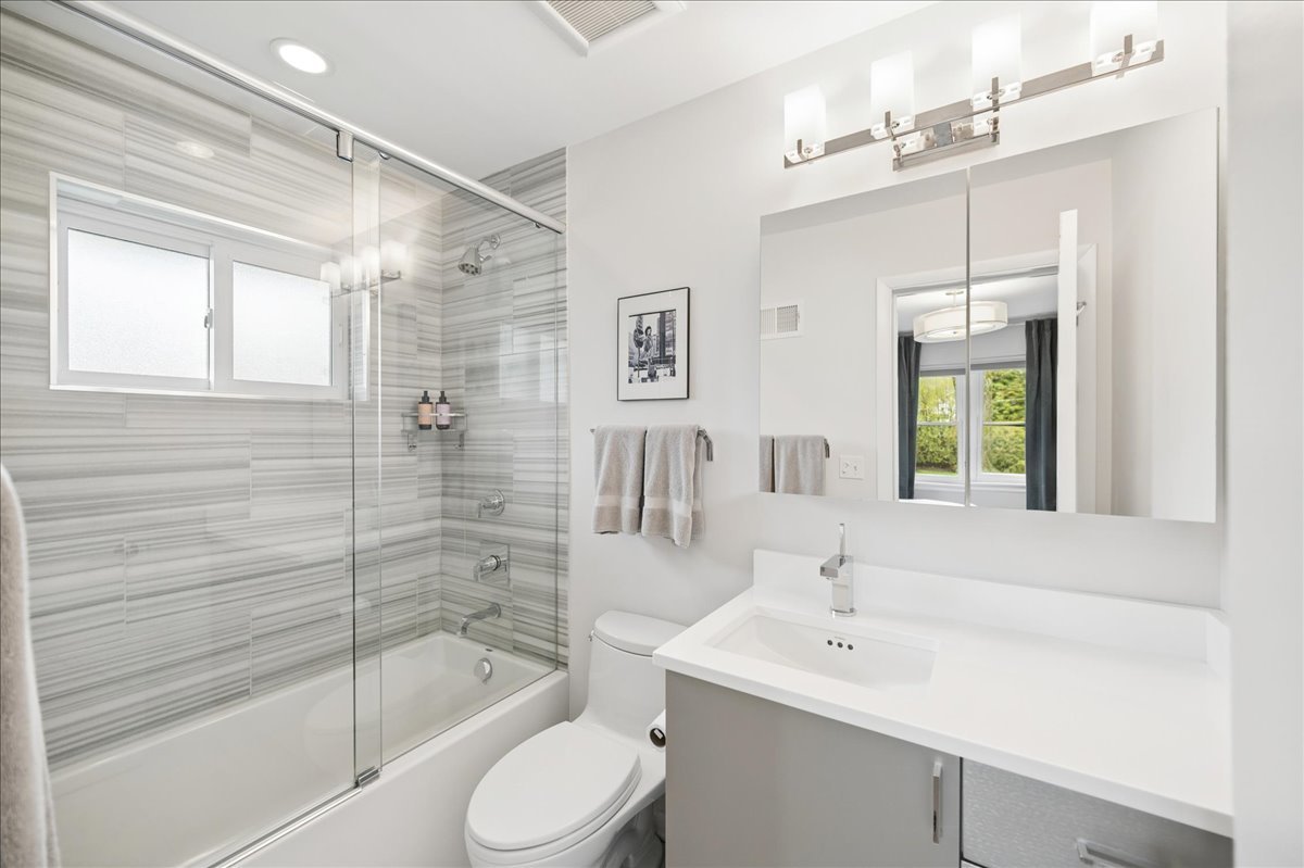 912 Hunter Road Wilmette, IL 60091 - Photo 21 of 38 a bathroom with a sink toilet and shower