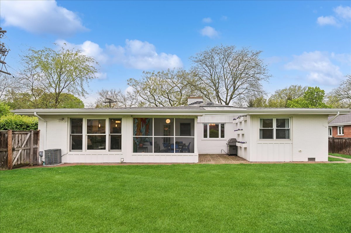 912 Hunter Road Wilmette, IL 60091 - Photo 31 of 38 a view of a house with backyard sitting area and garden
