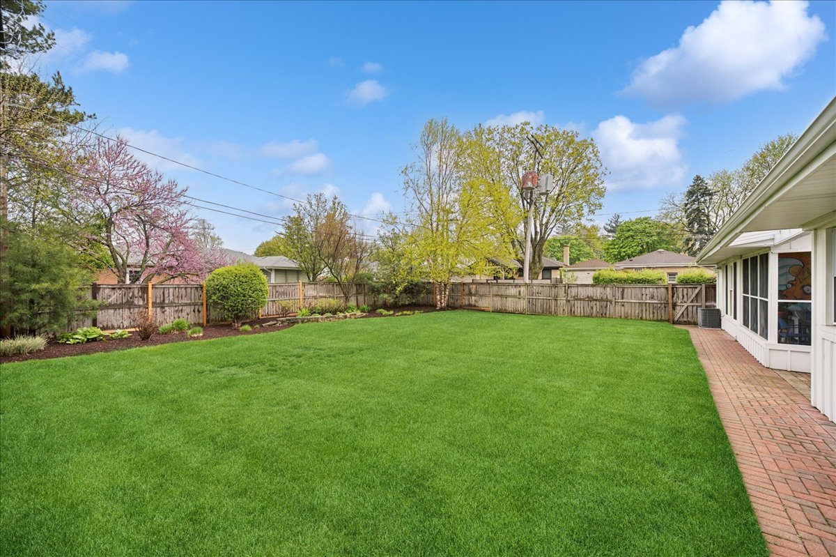 912 Hunter Road Wilmette, IL 60091 - Photo 35 of 38 a view of a house with a big yard and a fountain