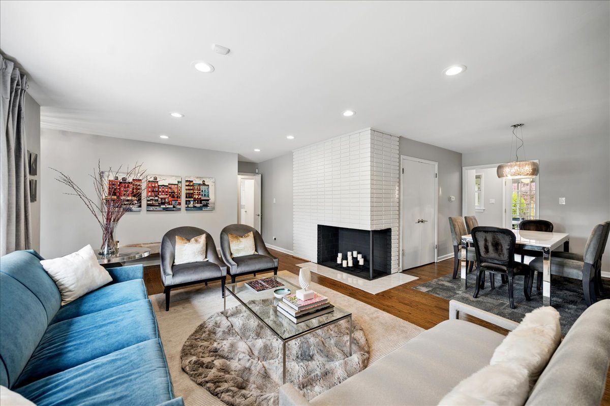 912 Hunter Road Wilmette, IL 60091 - Photo 4 of 38 a living room with furniture and a fireplace