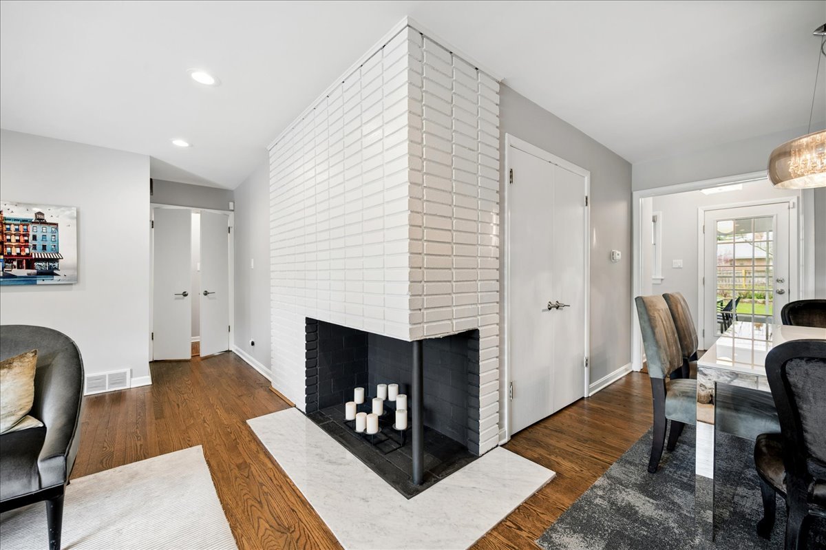 912 Hunter Road Wilmette, IL 60091 - Photo 8 of 38 a living room with furniture and a fireplace