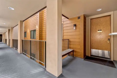 a lobby with furniture and floor to ceiling window