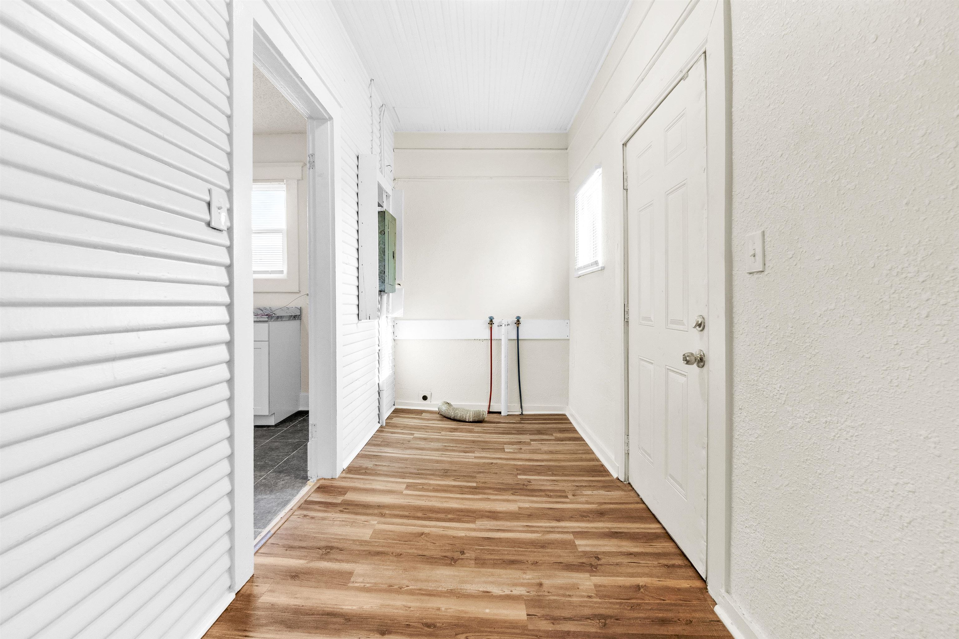 1100 Rozelle Street Memphis, TN 38106 - Photo 17 of 19 a view of a hallway with wooden floor and staircase