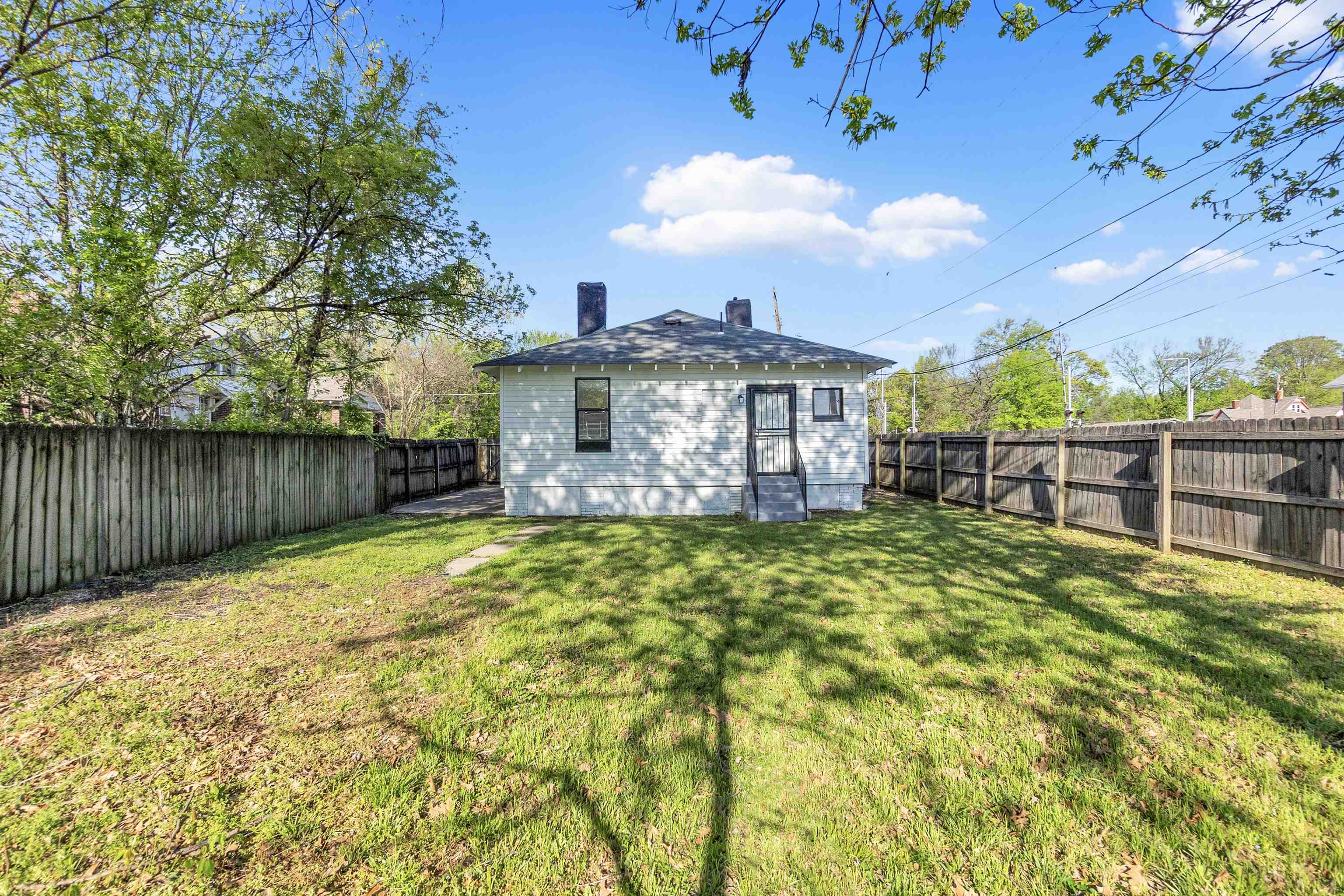 1100 Rozelle Street Memphis, TN 38106 - Photo 18 of 19 a view of a house with a swimming pool