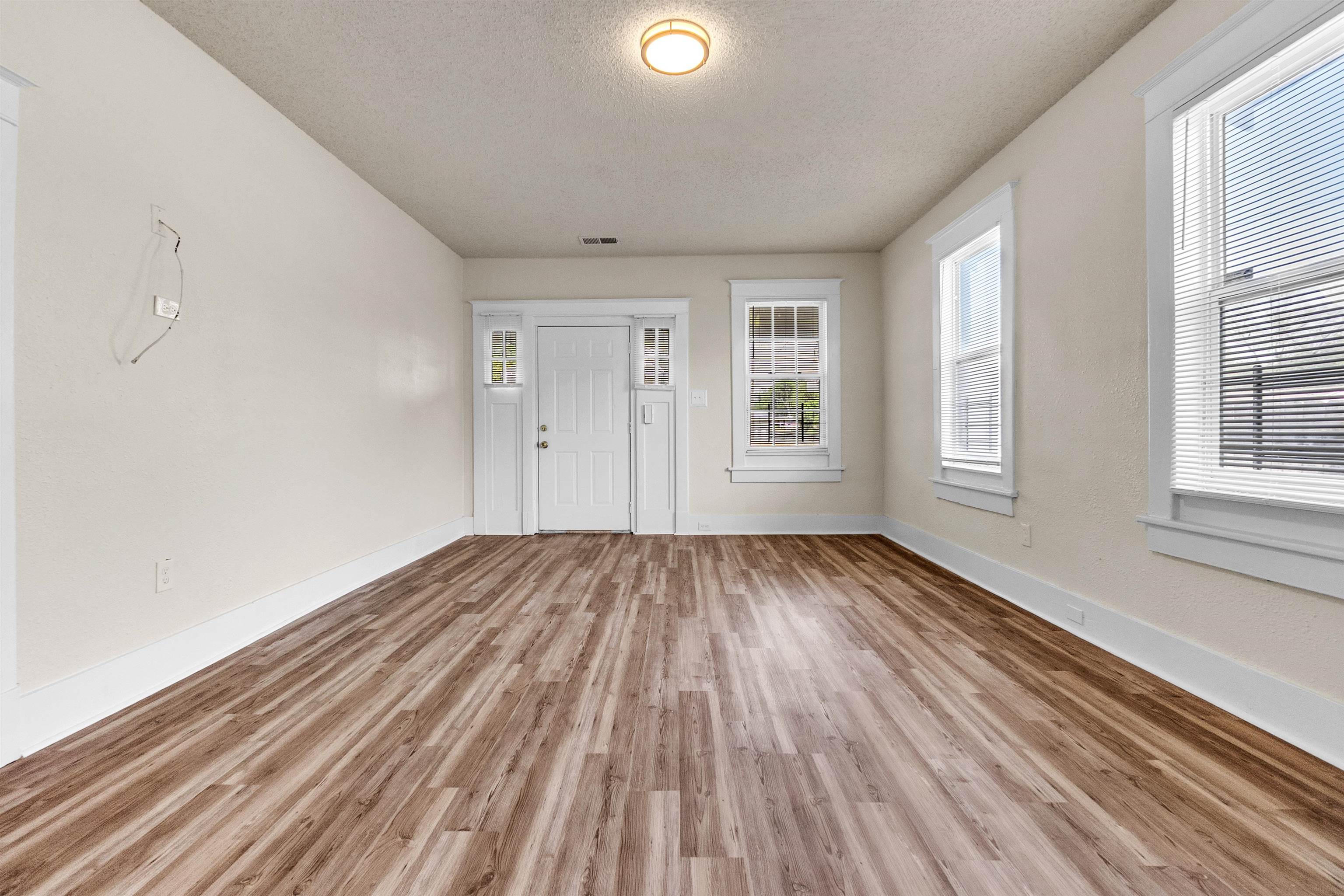 1100 Rozelle Street Memphis, TN 38106 - Photo 5 of 19 wooden floor in an empty room with a window