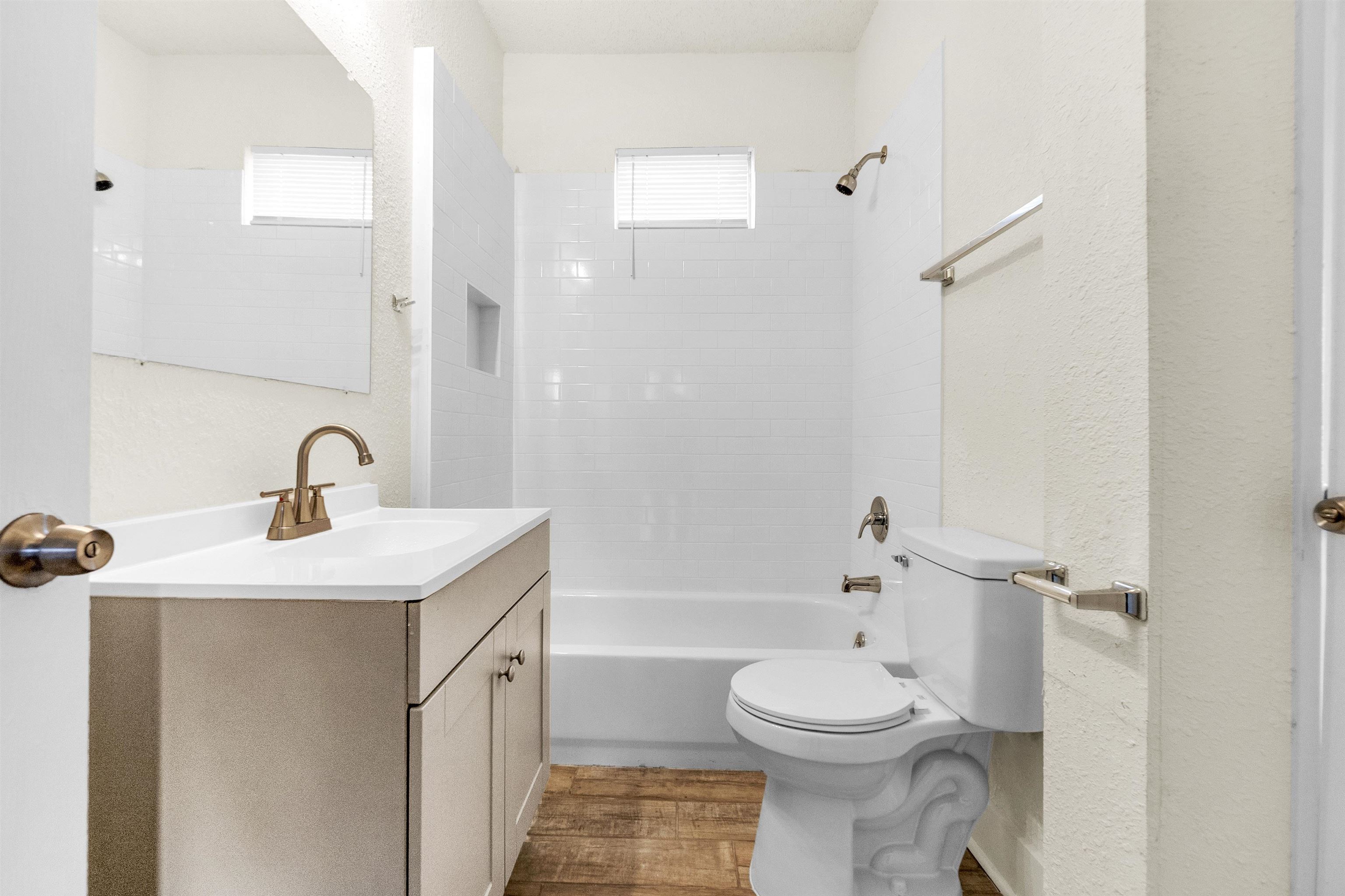 1100 Rozelle Street Memphis, TN 38106 - Photo 7 of 19 a bathroom with a toilet sink and a mirror