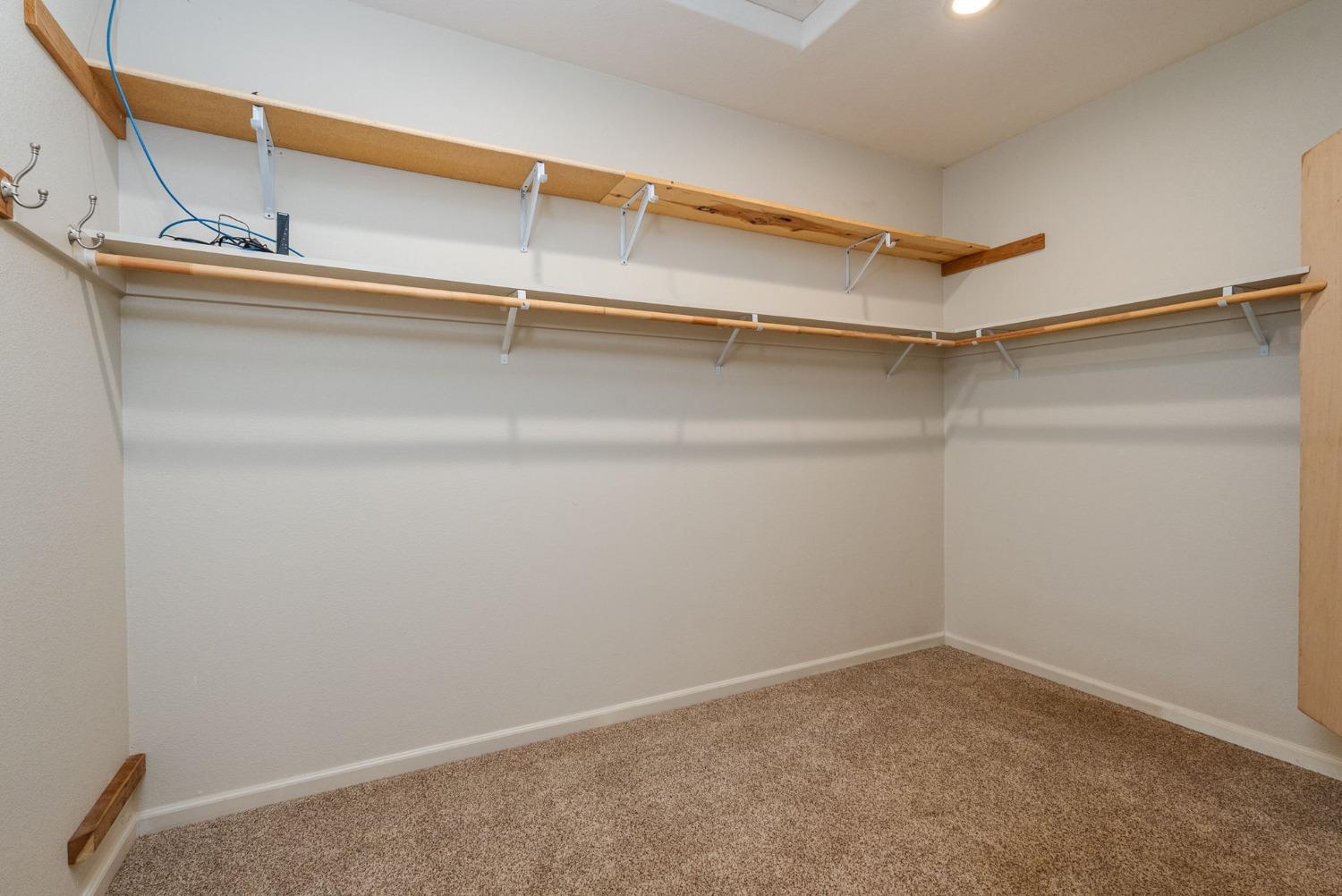 9080 El Dorado Trail Mountain Ranch, CA 95246 - Photo 31 of 48 a view of an empty walk in closet