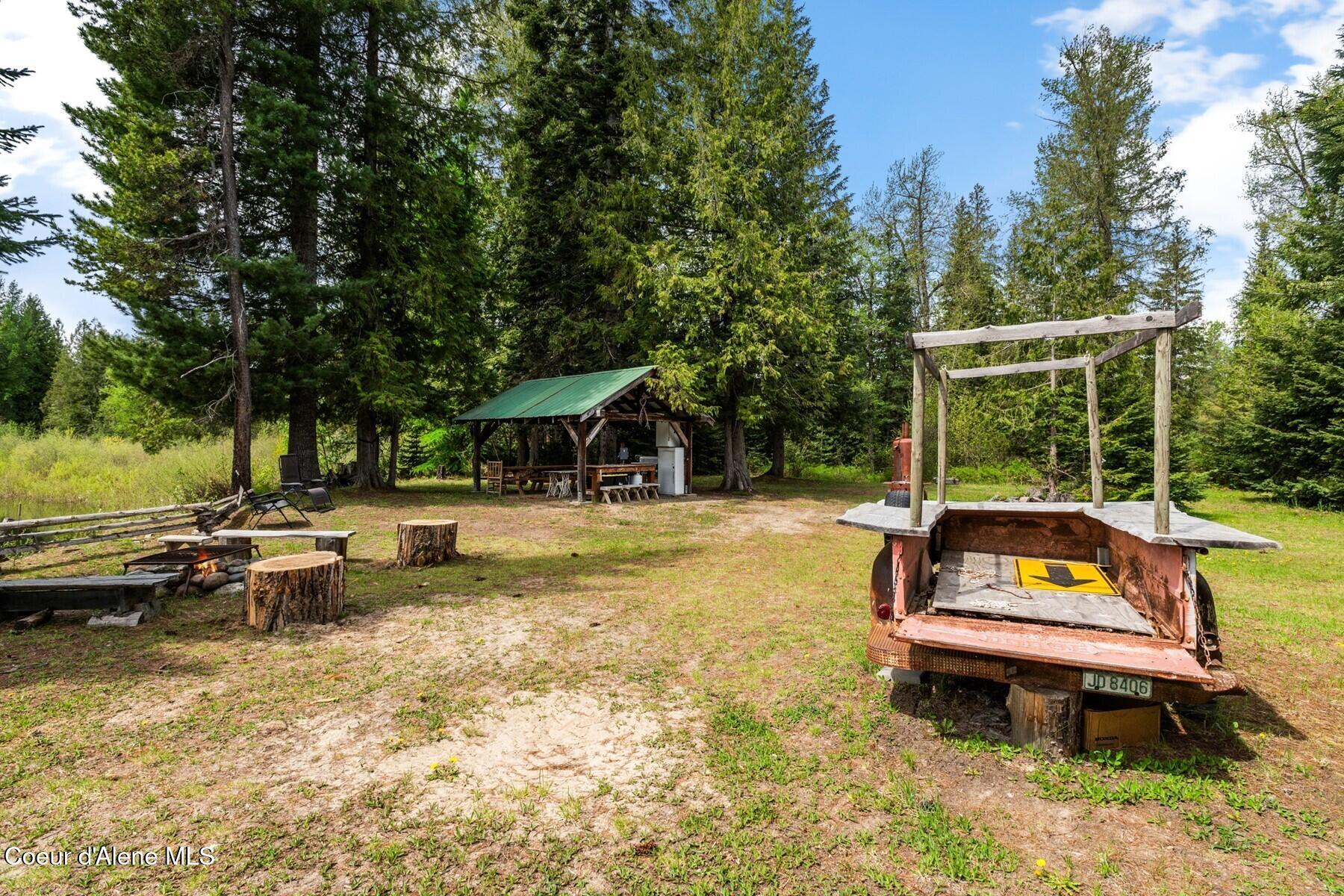 7019 Colburn Culver Road Sandpoint, ID 83864 - Photo 46 of 54 Summer Kitchen Fire Pit