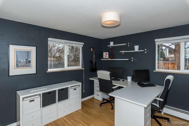 3520 Ward Road Wheat Ridge, CO 80033 - Photo 14 of 22 a view of a workspace with furniture and a window
