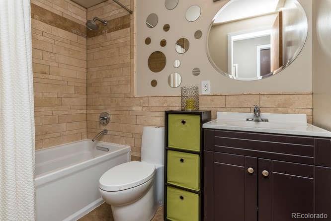 3520 Ward Road Wheat Ridge, CO 80033 - Photo 16 of 22 a bathroom with a sink toilet and shower