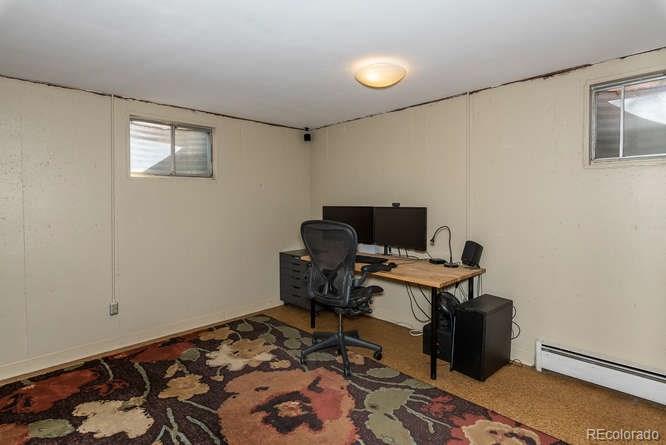 3520 Ward Road Wheat Ridge, CO 80033 - Photo 19 of 22 a workspace with furniture and wooden floor