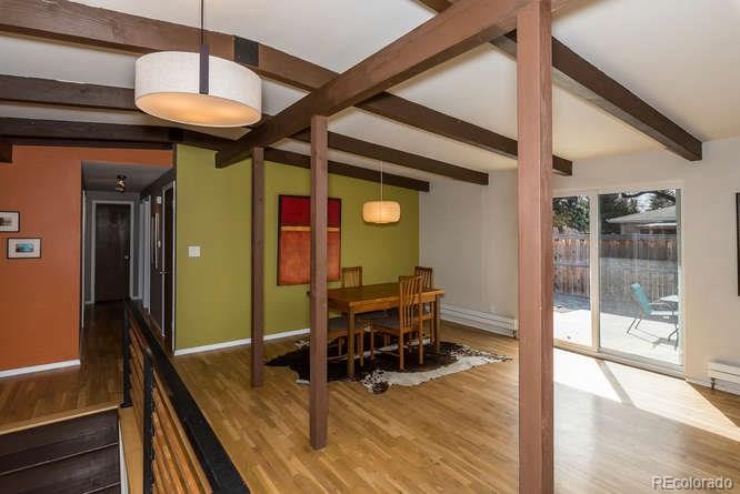 3520 Ward Road Wheat Ridge, CO 80033 - Photo 2 of 22 a dining room with furniture and wooden floor