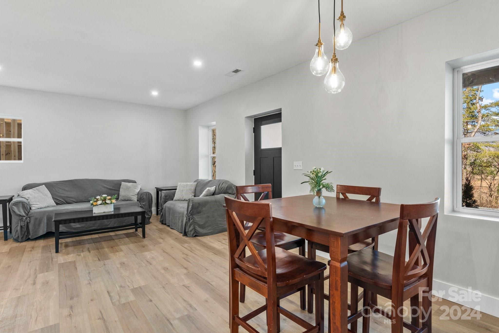 32 Access Road Black Mountain, NC 28711 - Photo 12 of 34 a view of a dining room with furniture and chandelier