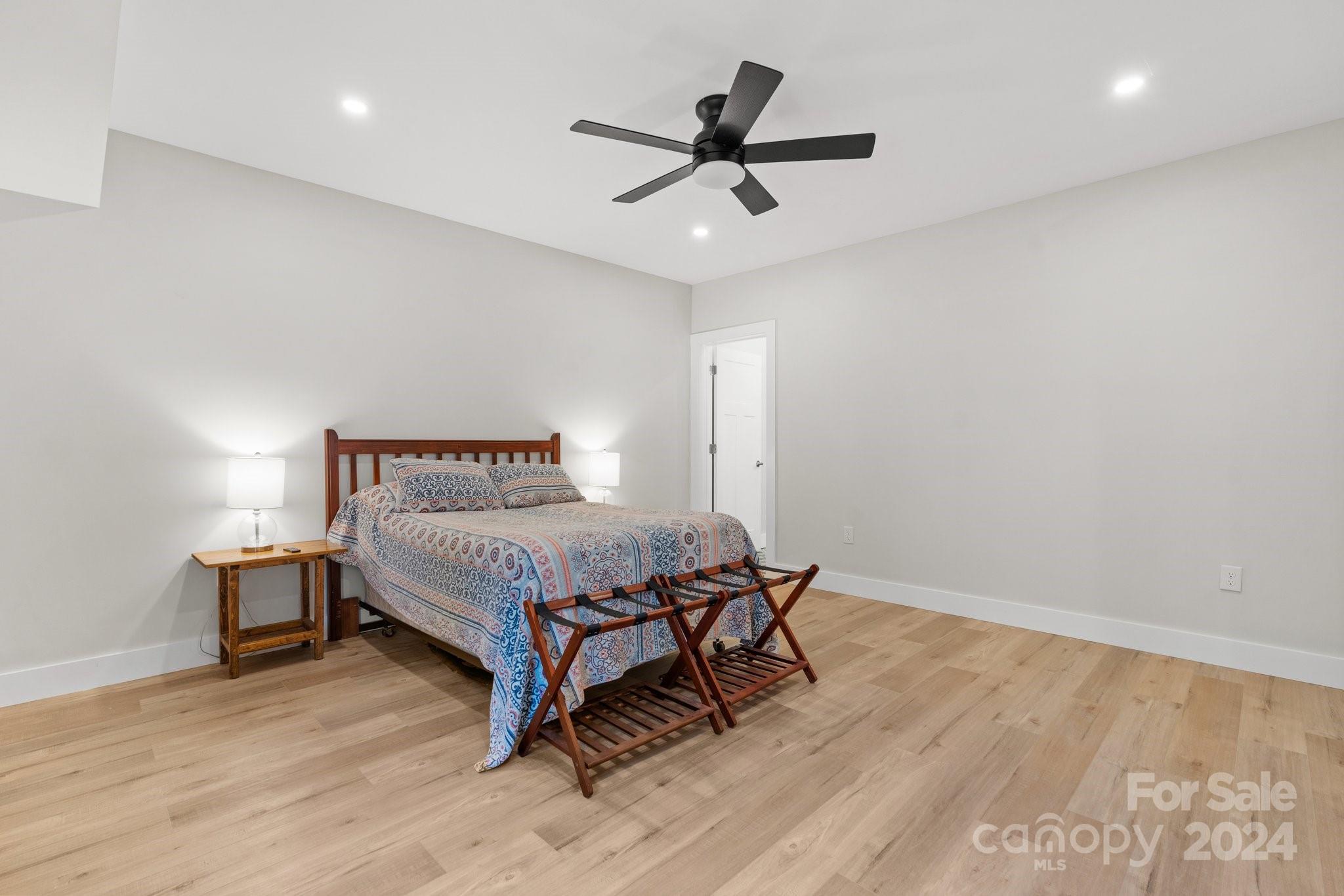 32 Access Road Black Mountain, NC 28711 - Photo 14 of 34 a bedroom with a bed and a table