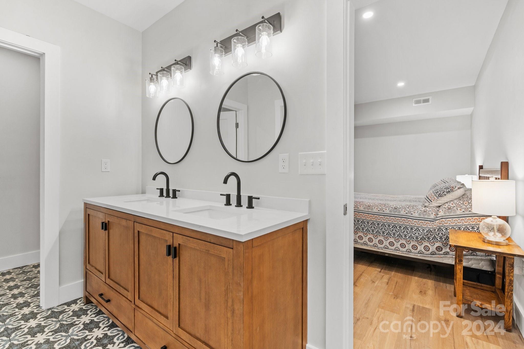 32 Access Road Black Mountain, NC 28711 - Photo 15 of 34 a bathroom with a sink and a mirror