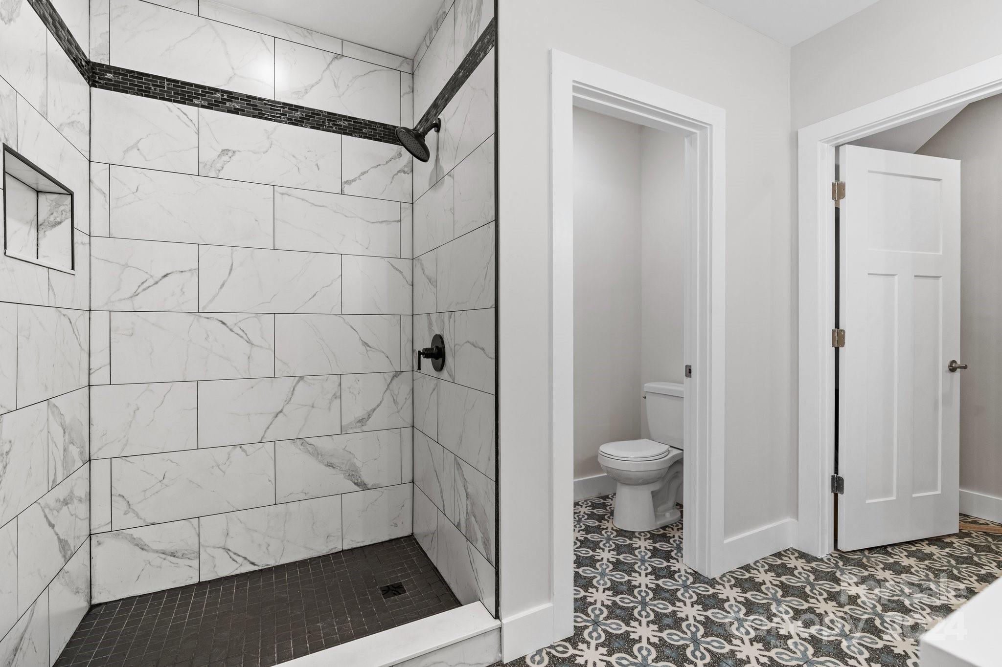 32 Access Road Black Mountain, NC 28711 - Photo 16 of 34 a bathroom with a toilet and a shower