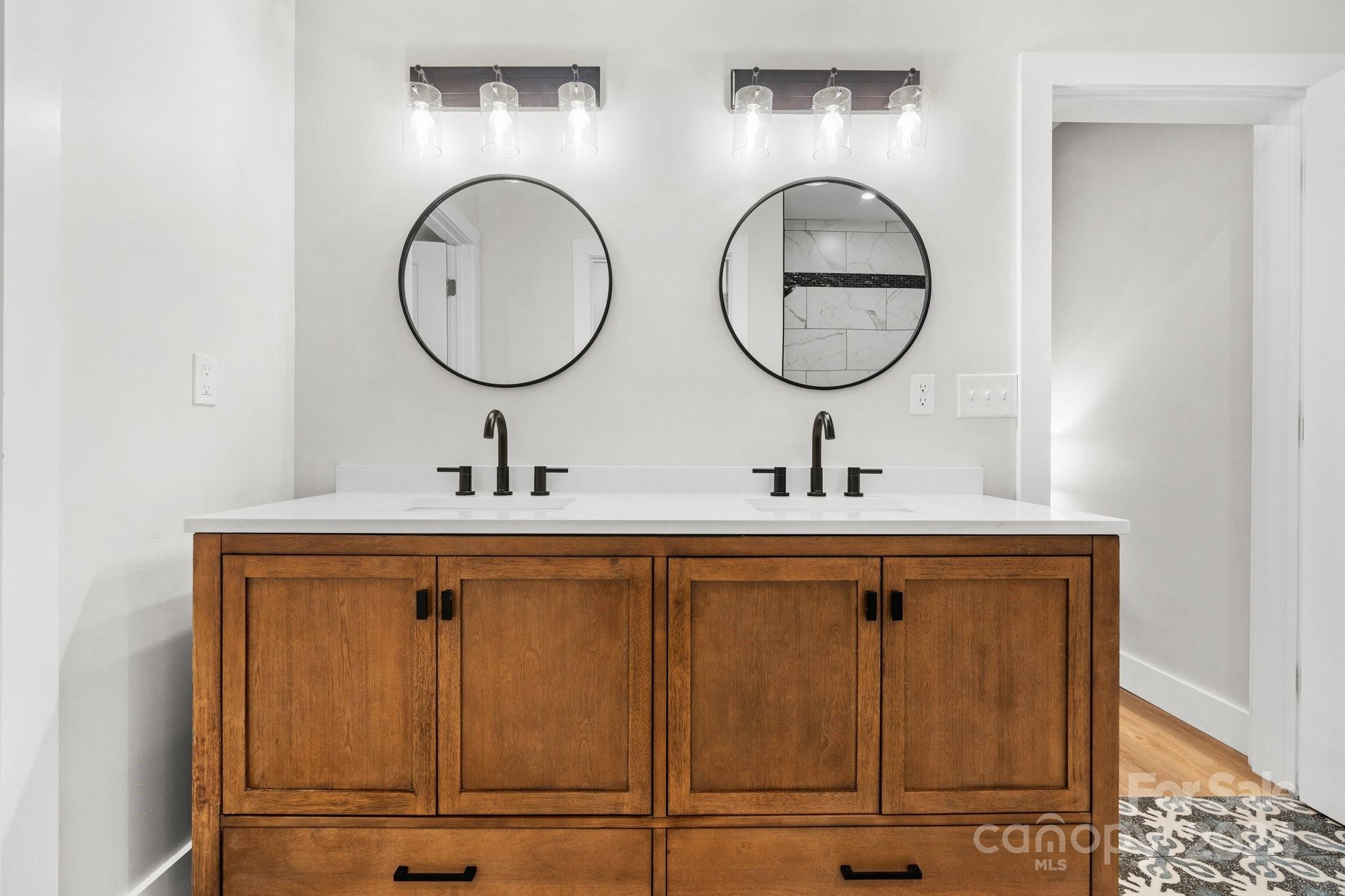32 Access Road Black Mountain, NC 28711 - Photo 17 of 34 a bathroom with a sink and a mirror