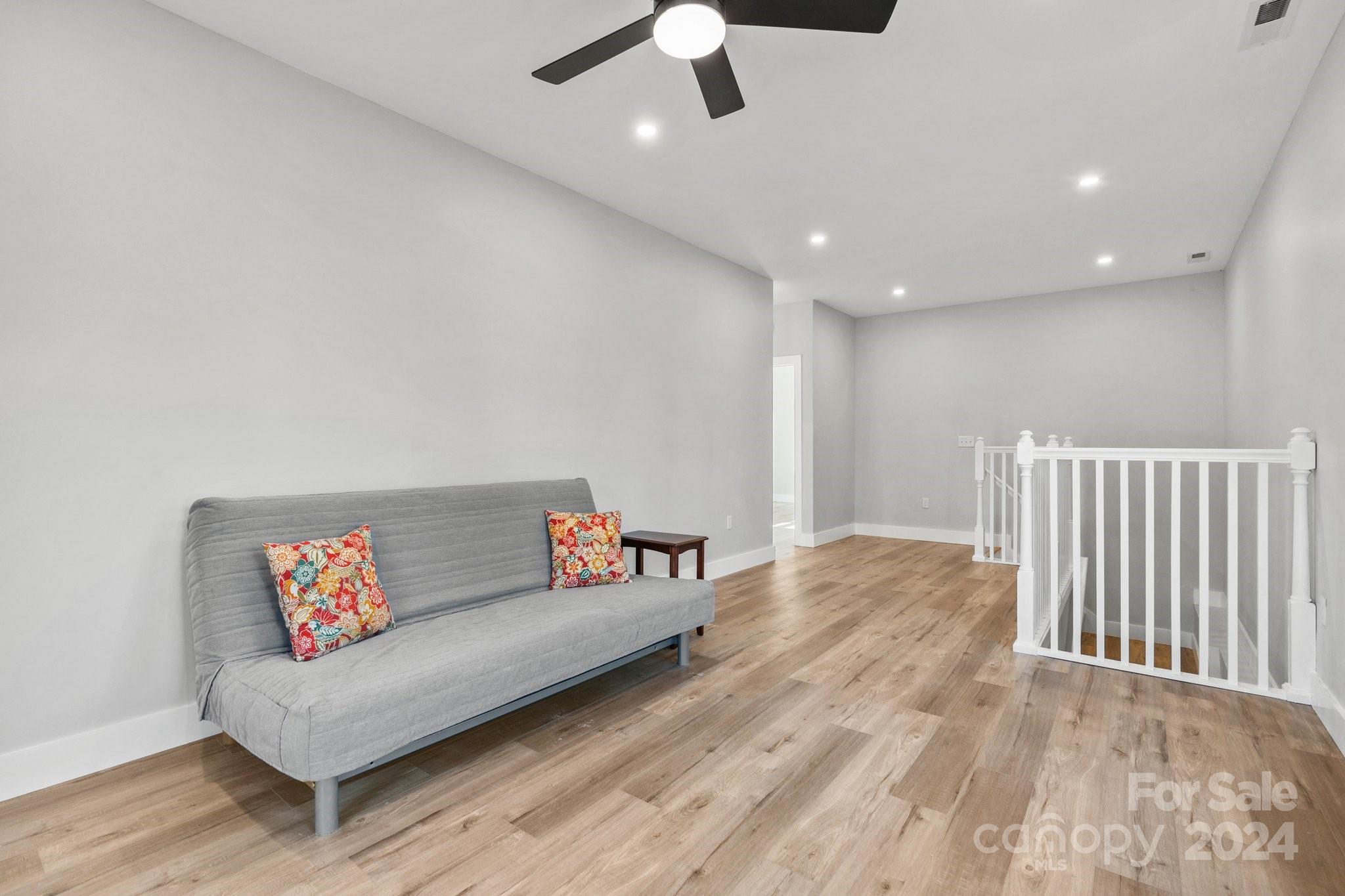 32 Access Road Black Mountain, NC 28711 - Photo 22 of 34 a living room with furniture and a ceiling fan