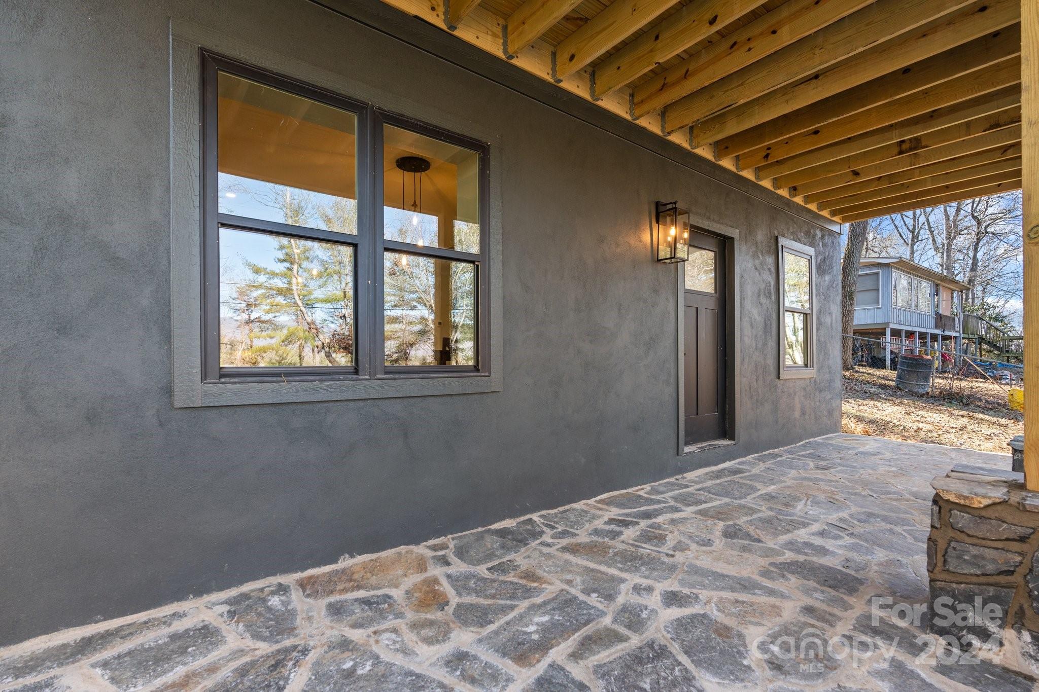 32 Access Road Black Mountain, NC 28711 - Photo 5 of 34 a bedroom with bed and wooden floor