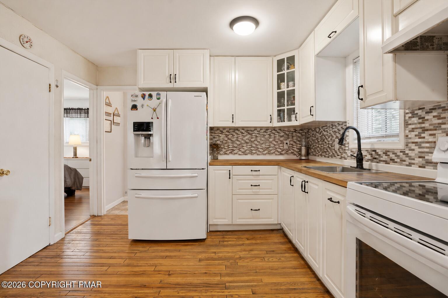 53 Barren Road East Stroudsburg, PA 18302 - Photo 12 of 57 a kitchen with white cabinets and white appliances