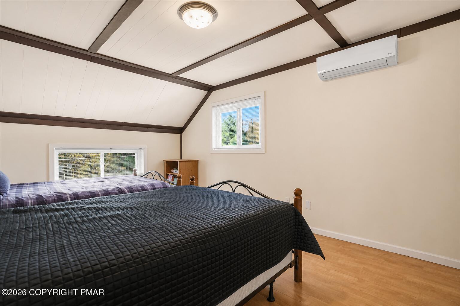 53 Barren Road East Stroudsburg, PA 18302 - Photo 26 of 57 a bedroom with a bed and wooden floor