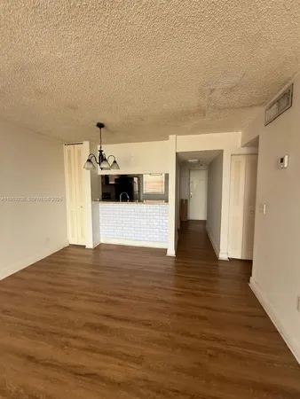 a view of a living room with a flat screen tv