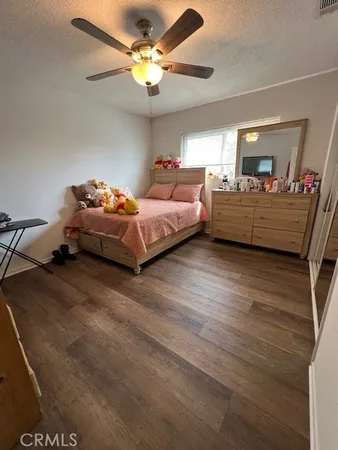 a bedroom with bed and window