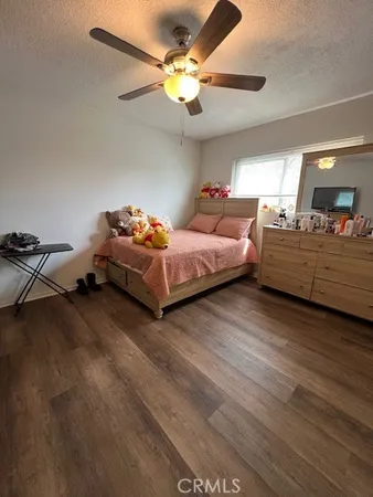 a bedroom with furniture and a chandelier