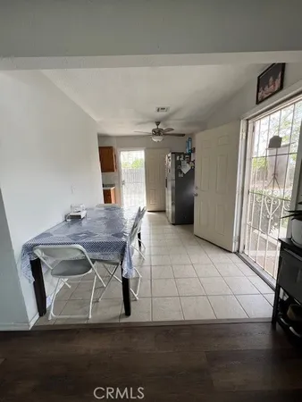 a view of a livingroom with furniture and a window