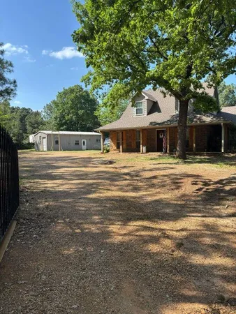 a house with trees in the background