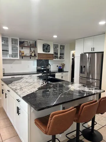 a room with washing machine and a gate