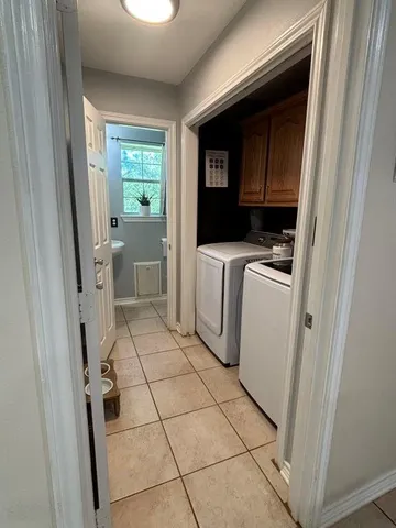 a bedroom with a bed and a flat tv screen