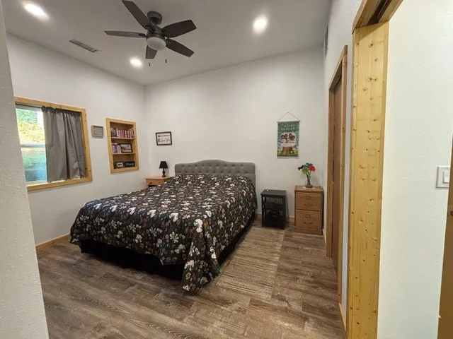 a bedroom with a bed and a dresser