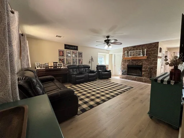 a living room with furniture and a fireplace