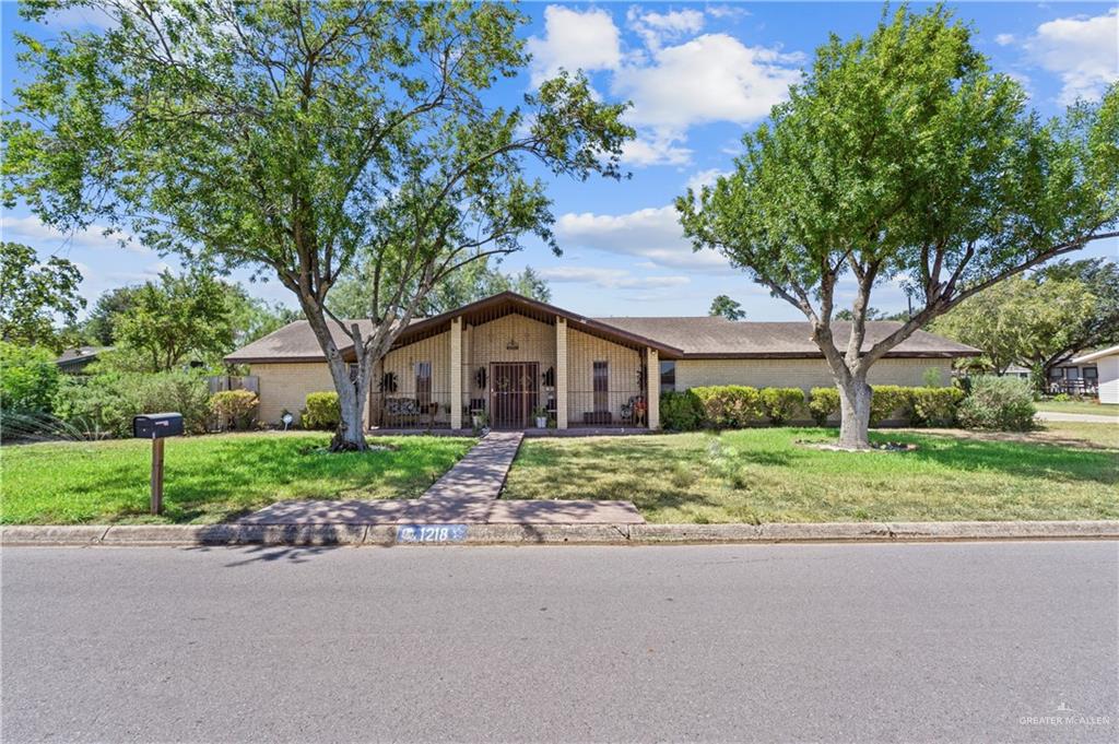 1218 East Alan Street Pharr, TX 78577 - Photo 1 of 1 a front view of house with yard and green space