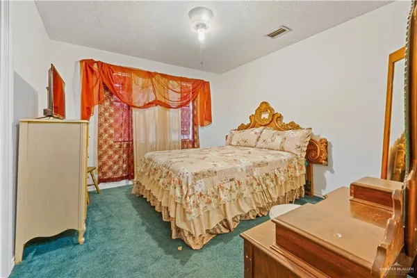 a bed room with a bed and a window