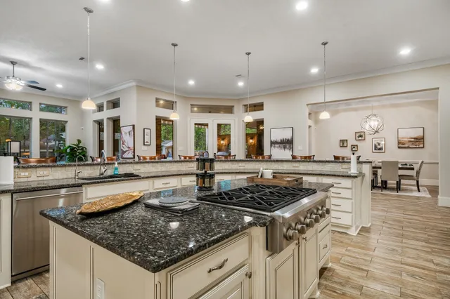 a kitchen with stainless steel appliances granite countertop a stove and a sink