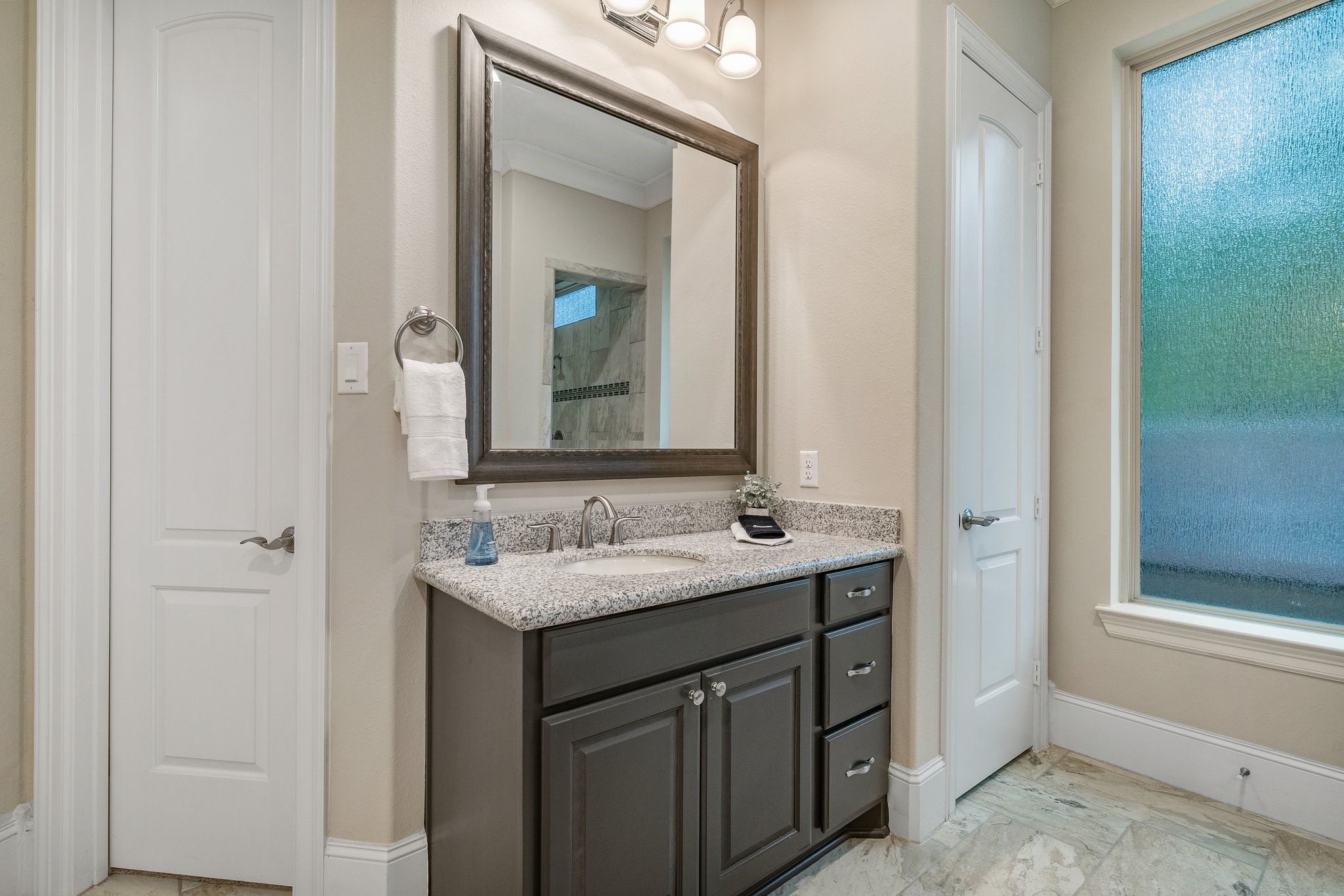 27411 Hazy Landing Court Spring, TX 77386 - Photo 26 of 50 a bathroom with a double vanity sink and a mirror
