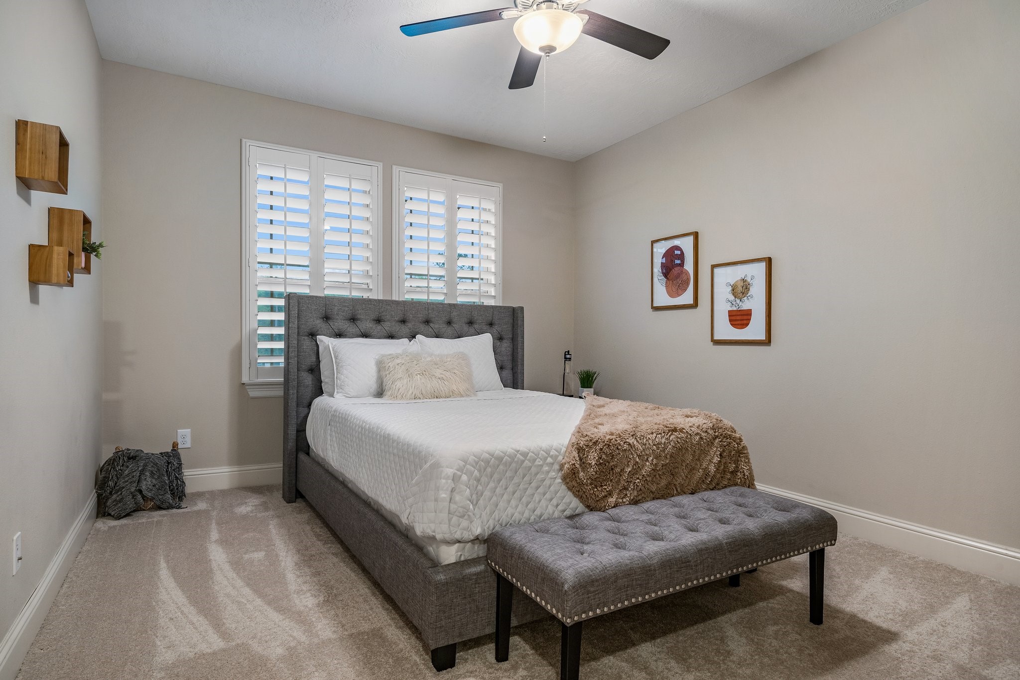 27411 Hazy Landing Court Spring, TX 77386 - Photo 37 of 50 a bedroom with a bed and a chandelier