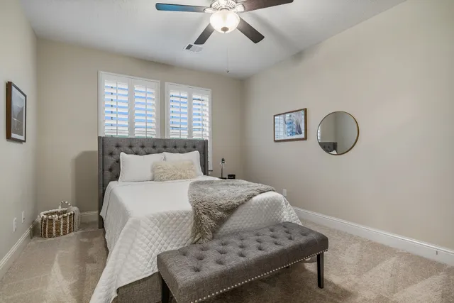 a bedroom with a bed and window