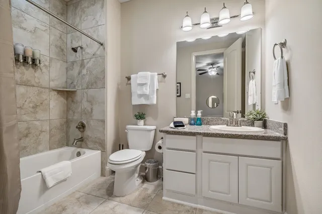 a bathroom with a double vanity sink mirror double and bathtub