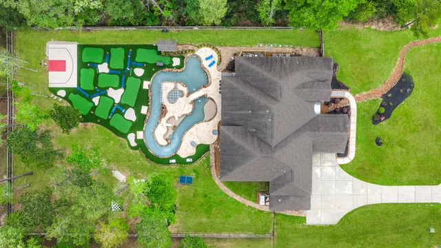 an aerial view of a house with a garden