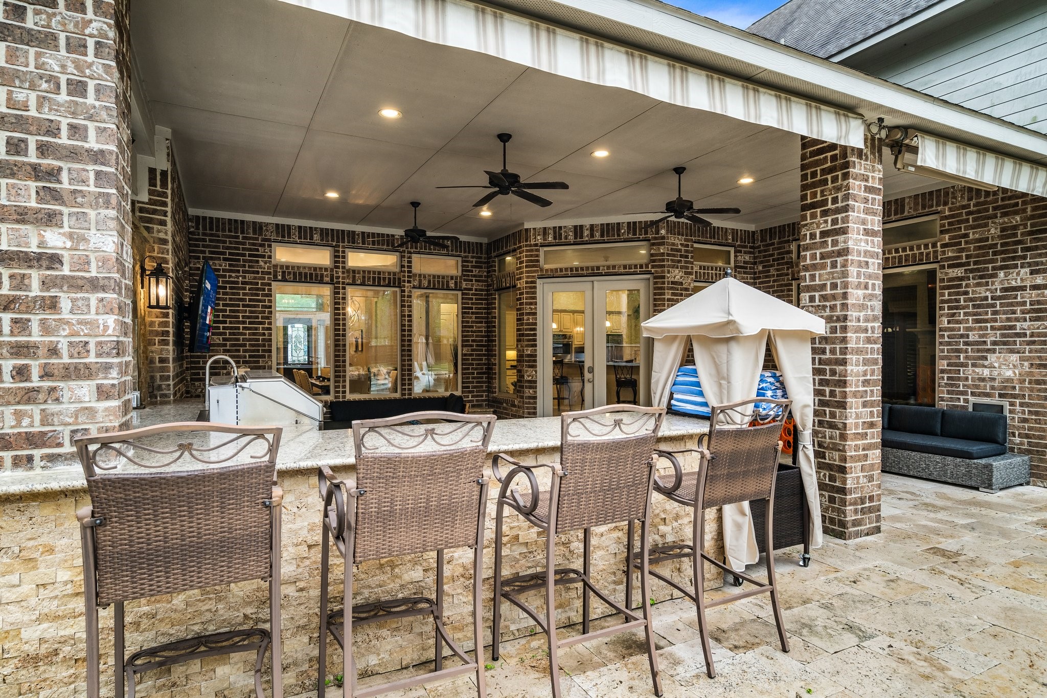 27411 Hazy Landing Court Spring, TX 77386 - Photo 47 of 50 a view of a patio with dining table and chairs under an umbrella