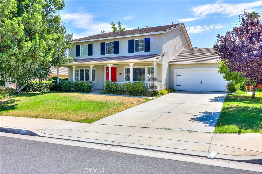 8376 Queen Anne Lane Riverside, CA 92508 - Photo 1 of 1 a front view of a house with a yard and potted plants