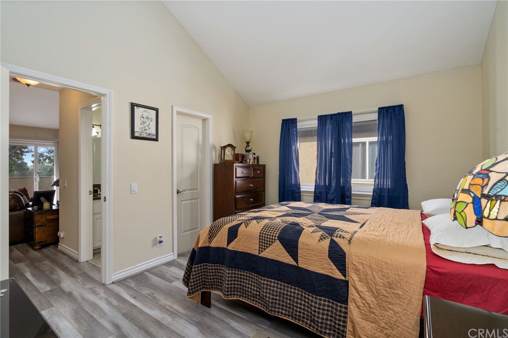 2925 East Spaulding Street, Unit 307 Long Beach, CA 90804 - Photo 15 of 18 a bedroom with a bed and a closet