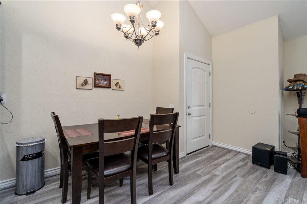 2925 East Spaulding Street, Unit 307 Long Beach, CA 90804 - Photo 8 of 18 a view of a dining room with furniture and wooden floor