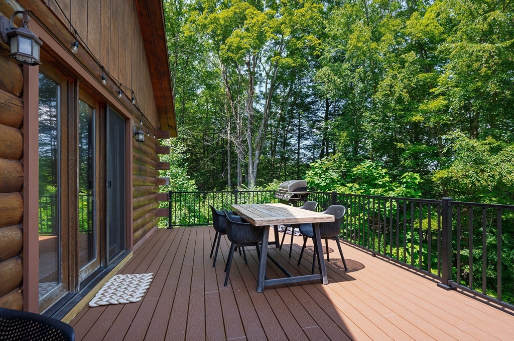 124 East Hawley Road Hawley, MA 01339 - Photo 24 of 39 a balcony with wooden floor table and chairs